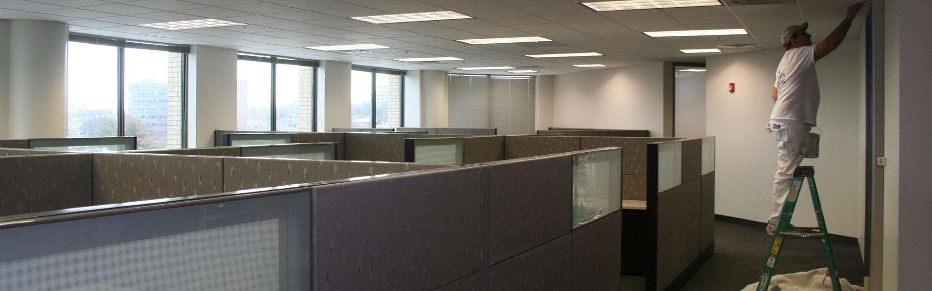 Commercial painting contractors working on professional office interior in Frisco, Texas